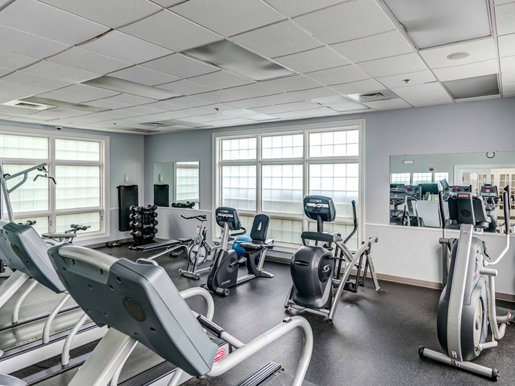 fitness center with cardio and weight equipment